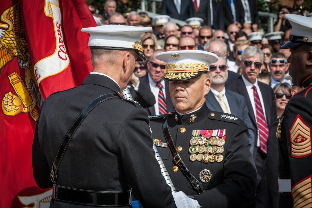 Gen. Robert B. Neller receives the Marine Corps Battle Colors from the 36th Commandant of the Marine Corps, Gen. Joseph F. Dunford Jr., at Marine Barracks Washington, D.C., Sept. 24, 2015. Neller became the 37th Commandant of the Marine Corps during the Passage of Command Ceremony. (U.S. Marine Corps photo by Sgt. Melissa Marnell, Office of the Sergeant Major of the Marine Corps/Released).