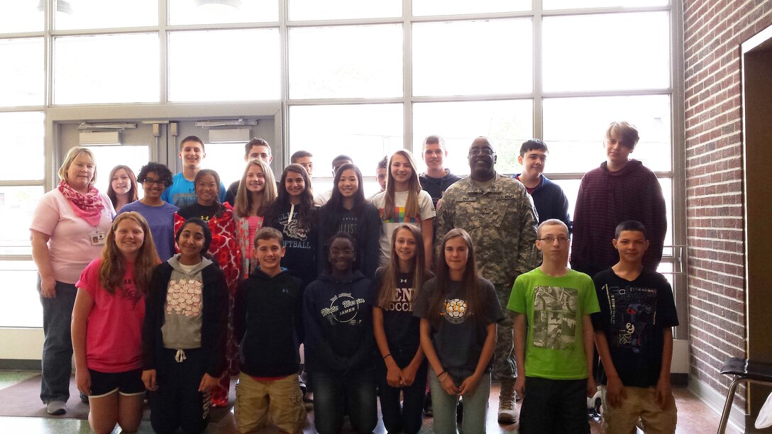 Defense Logistics Agency Distribution commander Army Brig. Gen. Richard Dix volunteers with the Junior Achievement Program of Central Pennsylvania at New Cumberland Middle School.