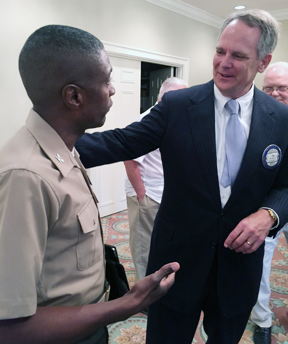 Col. James C. Carroll III, commanding officer, Marine Corps Logistics Base Albany, visits the Albany Rotary Club during lunch at Doublegate Country Club, Albany, Ga., Sept. 24, as a guest of longtime member, Dr. John Culbreath, former superintendent, Dougherty County School System. Carroll greeted program speaker Dr. Jere Morehead, president, University of Georgia and Vic Sullivan, president, Albany Rotary Club. According to Culbreath, the Albany Rotary Club is a part of a world-wide civic and service organization. Locally, the organization funds literacy programs, United Way and other organizations. "We also give scholarships to outstanding graduates from all public and private high schools in Dougherty County,” Culbreath said. “It was my pleasure to have the Marine base represented today and I'm giving them an open invitation for future visits." 