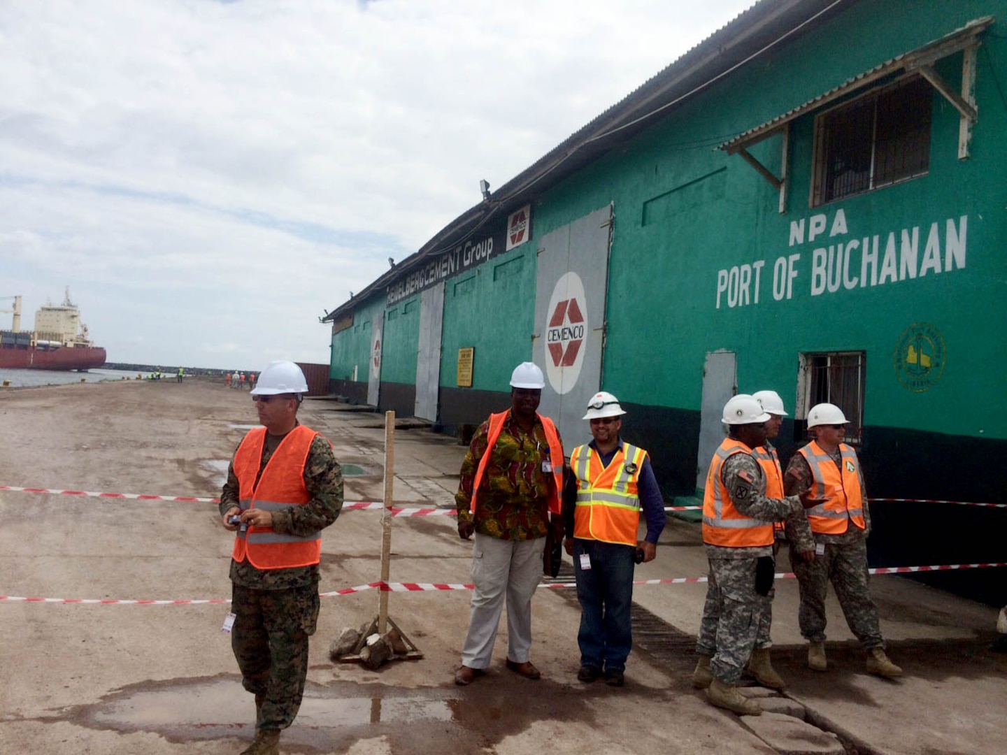 Officer in Charge United States Marine Corps Maj. John Simpson, far left, at the port of Buchanan in Liberia. 