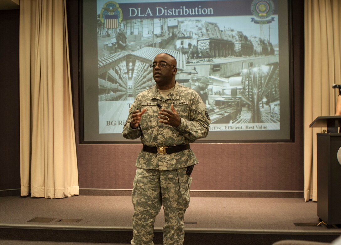 DLA Distribution commander Army Brig. Gen. Richard Dix discusses the achievements of the award winners at the June 25 town hall. 