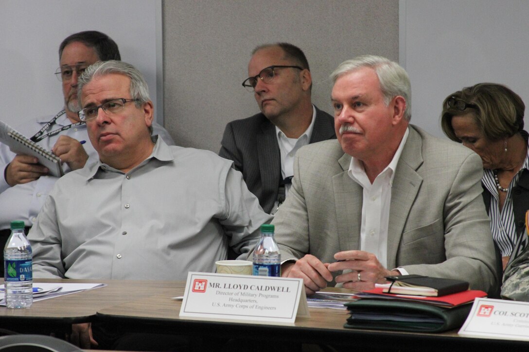 Joe Calcara, director of programs, USACE South Pacific Division, and the senior executive project manager for the U.S. Army Corps of Engineers’ Fort Irwin Weed Army Hospital replacement construction project and USACE Director of Military Programs Lloyd Caldwell listen to briefers during the project’s Senior Executive Review Group quarterly briefing at Fort Irwin Sept. 22. 