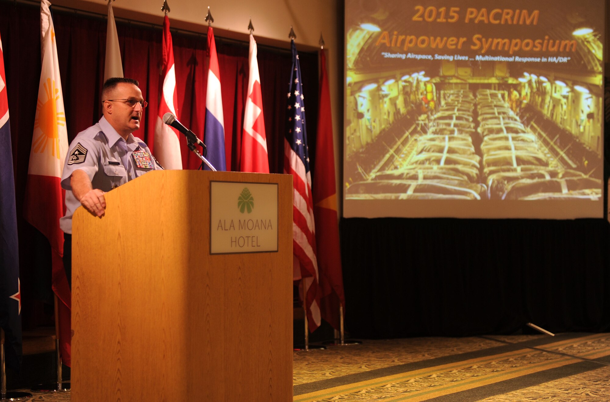 Chief MasterSgt. Buddy Hutchison, Pacific Air Forces command chief, engages in a discussion on senior enlisted development with attendees of the Pacific Rim Airpower Symposium Sept. 22, 2015, in Honolulu, Hawaii. Senior officer and enlisted airmen from nations throughout the Indo-Asia-Pacific region attended the symposium to discuss ways to improve cooperation, leadership and coordination efforts. (U.S. Air Force photo by Staff Sgt. Alexander Martinez/Released)