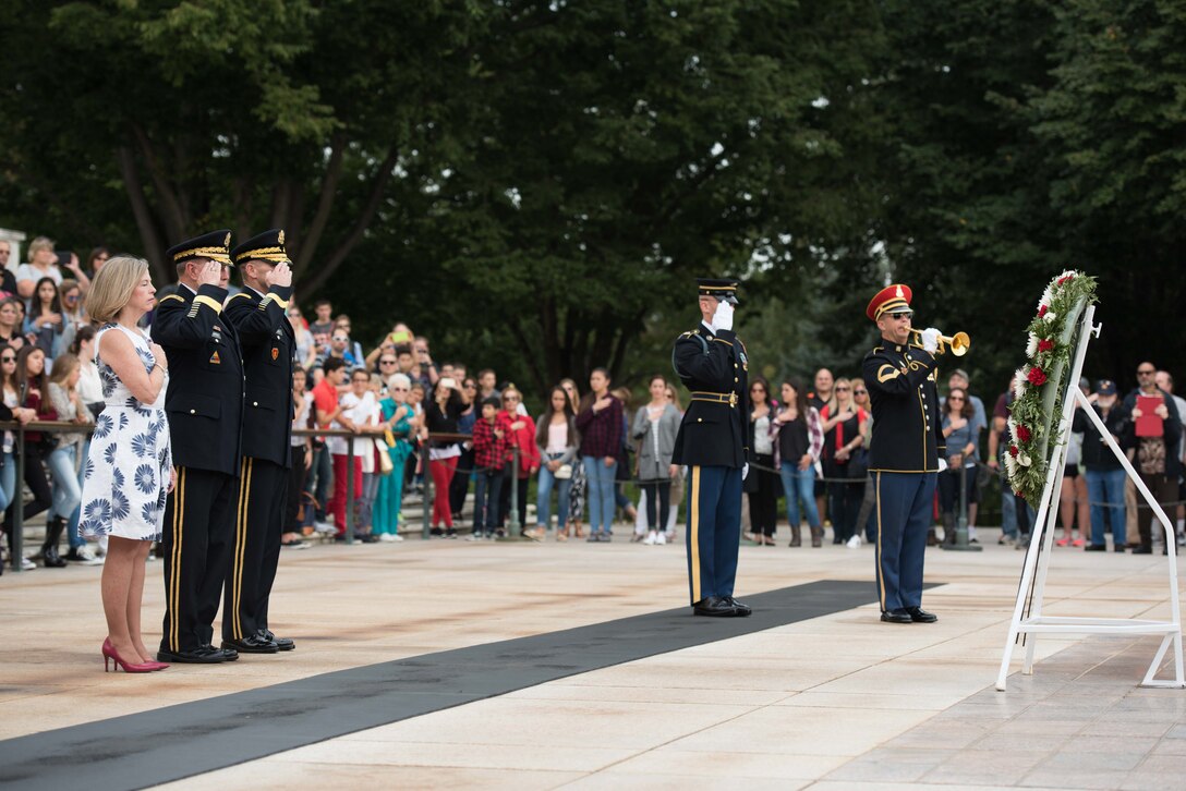 Army Gen. Martin E. Dempsey, chairman of the Joint Chiefs of Staff, and his wife, Deanie, render honors after placing a wreath at the Tomb of the Unknown Soldier at Arlington National Cemetery in Arlington, Va., Sept. 25, 2015. U.S. Army photo by Spc. Cody W. Torkelson