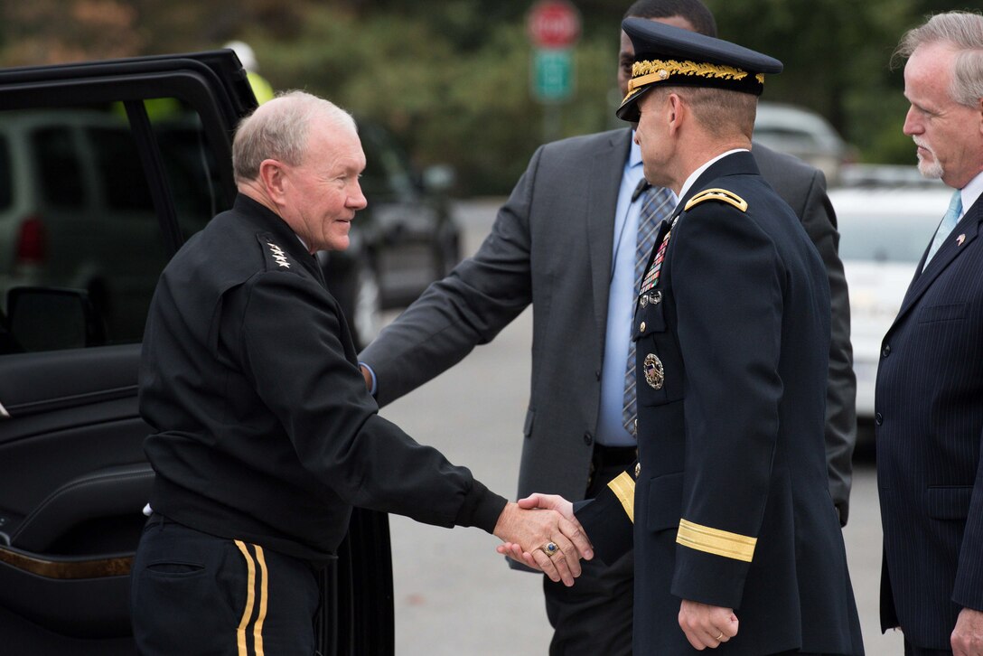 Army Gen. Martin E. Dempsey, left, chairman of the Joint Chiefs of Staff, arrives to place a wreath at the Tomb of the Unknown Soldier at Arlington National Cemetery in Arlington, Va., Sept. 25, 2015. U.S. Army photo by Spc. Cody W. Torkelson