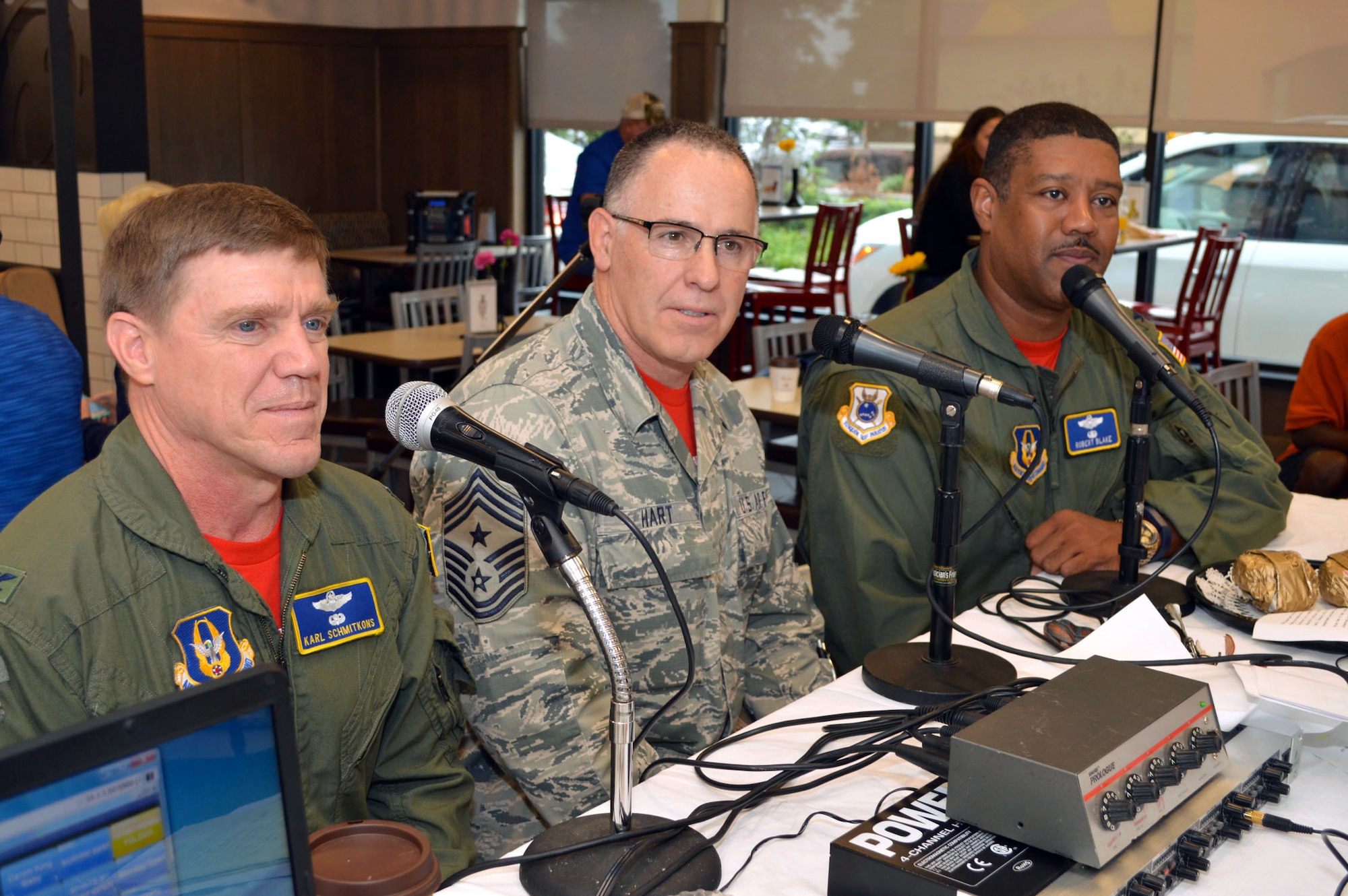 Col. Karl Schmitkons, 440th Airlift Wing commander, left, Command Chief Master Sgt. Rocky Hart, 440th AW command chief, middle, and Col. Robert Blake, 440th AW vice commander, right, join Jeff "Goldy" Goldberg and Jim Cooke of WFNC 640 AM radio for a live on-air interview celebrating the third anniversary of WFNC's 'Good Morning Fayetteville' radio show Sept. 25, 2015,at the Chick-fil-A on Skibo Road, Fayetteville, North Carolina. (U.S. Air Force photo/Marvin Krause)