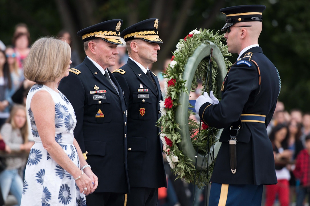 Army Gen. Martin E. Dempsey, chairman of the Joint Chiefs of Staff, prepares to place a wreath at the Tomb of the Unknown Soldier at Arlington National Cemetery in Arlington, Va., Sept. 25th, 2015. Dempsey laid the wreath to honor unknown service members as he prepares to retire after 41 years of service. U.S. Army photo by Spc. Cody W. Torkelson