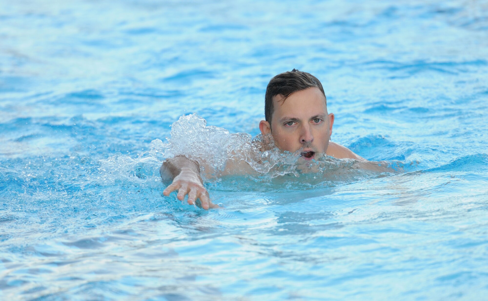 Staff Sgt. Jacob Tucker, 334th Training Squadron , participates in the in the 200-yard swim during Keesler’s mini-triathlon Sept. 25, 2015, Keesler Air Force Base, Miss. The event also included a 9-mile bike ride and a 2-mile run. (U.S. Air Force photo by Kemberly Groue)