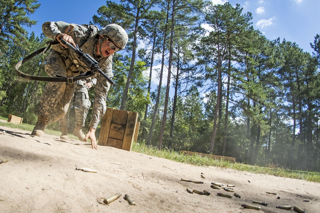 Army Pvt. Karlois Cesunas hustles out of the prone position from behind a barrier during basic training on Fort Jackson, S.C., Sept. 19, 2015. U.S. Army photo by Sgt. Ken Scar