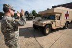 Sgt. Julian O’Hare, 50th Infantry Brigade Combat Team, New Jersey Army National Guard, directs a medical Humvee at the National Guard Armory in Woodbury, Sept. 24, 2015. The Soldiers are part of a task force comprised of Soldiers and Airmen who will be assisting New Jersey civil authorities with security during Pope Francis’s visit to Philadelphia Sept. 26-27. 