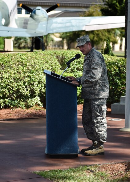 Col. Sean Farrell, 1st Special Operations Wing commander, speaks during a POW/MIA remembrance ceremony on Hurlburt Field, Fla., Sept. 17, 2015. Annually, Hurlburt Field pays tribute to POWs and those who are MIA during the ceremony, followed by a 24-hour ruck march and run. (U.S. Air Force photo by Senior Airman Jeff Parkinson)