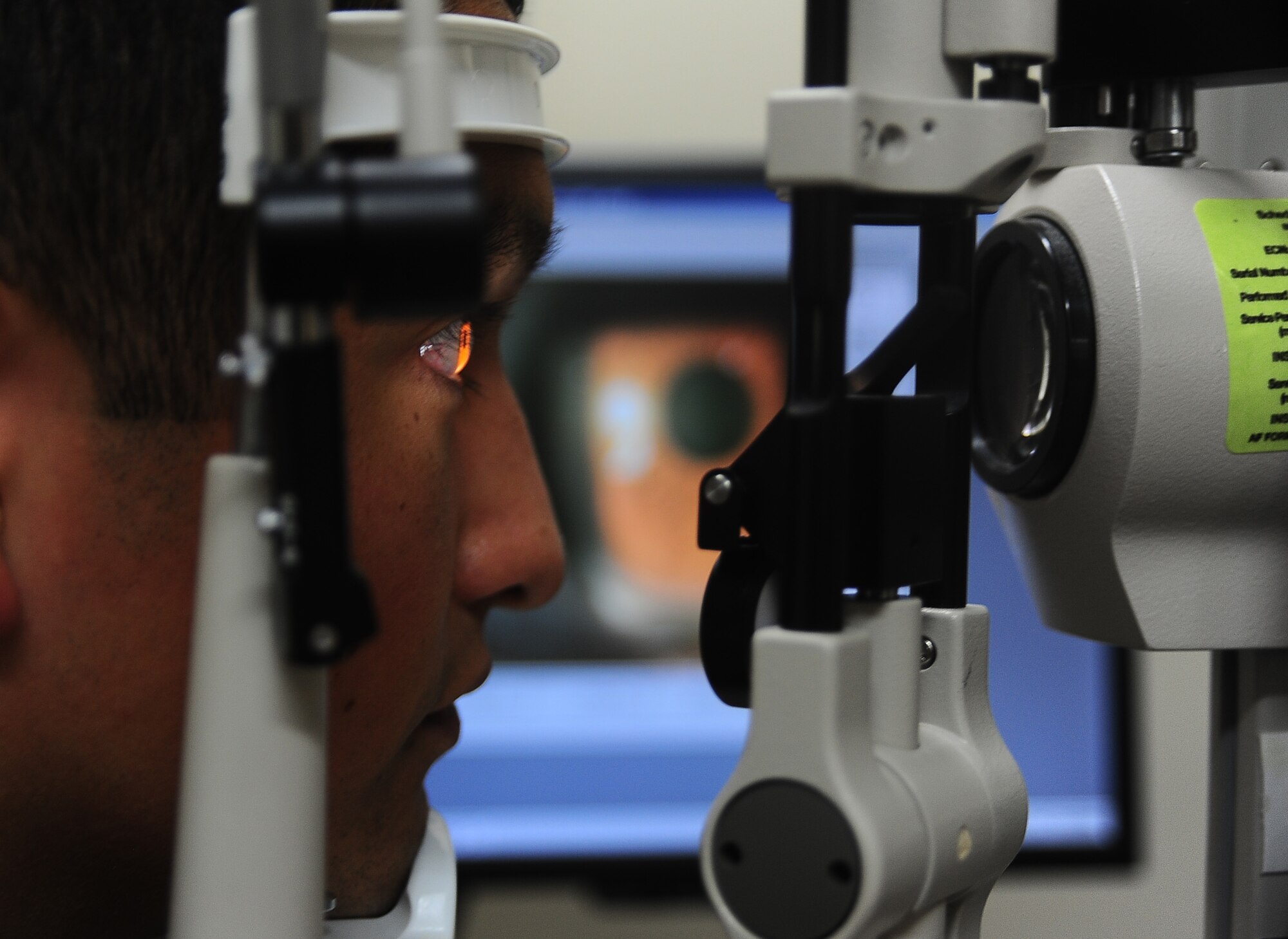 2nd Lt. Rogelio Castaneda, 14th Student Squadron, gets his eye examined Sept. 22 at the Columbus Air Force Base medical clinic. The 14th Medical Operations Squadron optometry clinic provides care to nearly five thousand members of the 14th Flying Training Wing, tenant units, retirees and dependents with services ranging from routine eye care to glasses and contact lens fittings every month. (U.S. Air Force photo/Airman 1st Class Daniel Lile)