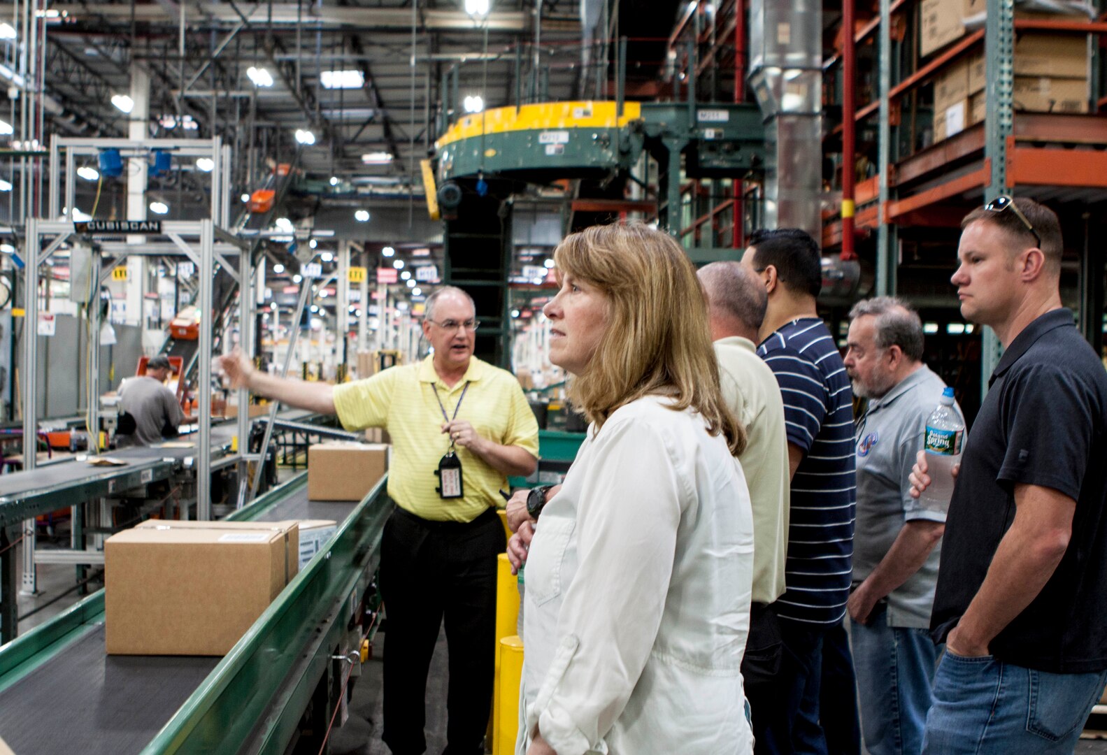 Ron Hunziker, left, DLA Distribution Susquehanna, Pa., shows TACOM’s Integrated Logistics Support Center the small parcel area in the Eastern Distribution Center.