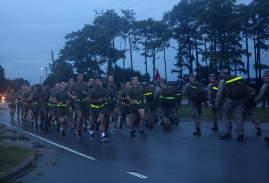 U.S. Marines and U.S. Navy Sailors with the 22nd Marine Expeditionary Unit (MEU) command element run a morning 5k at Marine Corps Base Camp Lejeune, N.C., Sept. 25, 2015. All sections within the MEU’s command element came together to build morale and unit cohesion. (U.S. Marine Corps photo by GySgt Freddy G. Cantu /Released)
