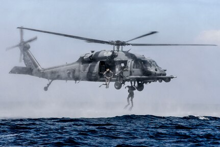 Airmen from the 320th Special Tactics Squadron, Kadena Air Base, perform a helo-casting jump out of a U.S. Air Force HH-60G Pave Hawk from the 33rd Rescue Squadron during an amphibious operations exercise Sept. 22, 2015, off the West Coast of Okinawa, Japan. Team members are qualified in non-standard methods of infiltration to include, static line, military freefall, and closed and open circuit diving. 