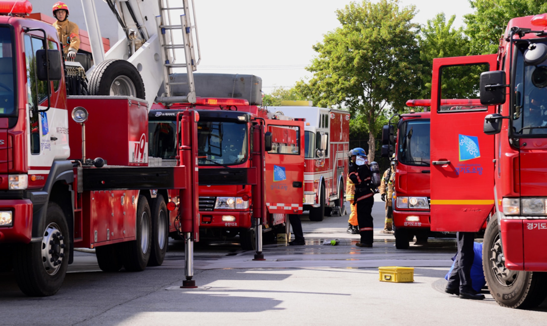 OSAN AIR BASE, Republic of Korea (Sept. 24, 2015) - Firefighters from the 51st Civil Engineer Squadron and South Korean first-responders line up their vehicles near a simulated factory fire near Songtan.  The 51 CES members are from Osan Air Base and took part in a hazardous materials training session in order to test each fire station's capabilities. 
