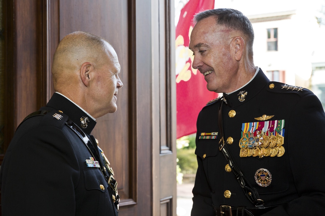 Gen. Robert B. Neller, right, welcomes Commandant of the Marine Corps, Gen. Joseph F. Dunford, Jr. at Marine Barracks Washington, D.C., Sept. 24, 2015. Dunford promoted Neller from the rank of lieutenant general to general in the Marine Corps. (U.S. Marine Corps photo by Sgt. Gabriela Garcia/Released)