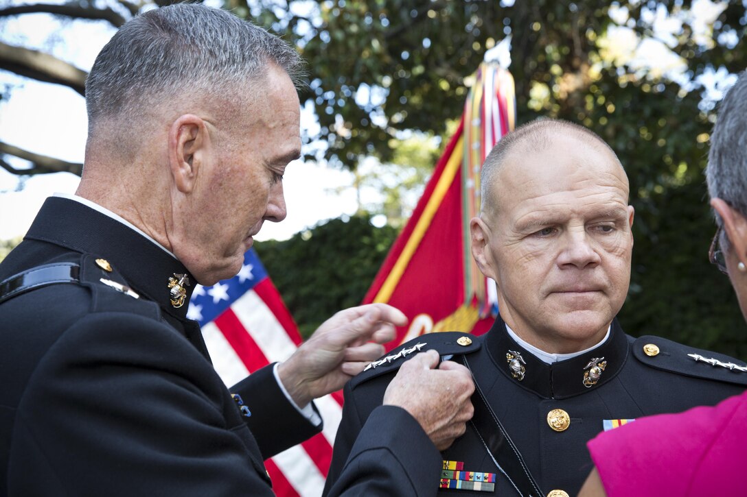 Commandant of the Marine Corps, Gen. Joseph F. Dunford, Jr., left, promotes Gen. Robert B. Neller at Marine Barracks Washington, D.C., Sept. 24, 2015. Neller was promoted from the rank of lieutenant general to general in the Marine Corps. (U.S. Marine Corps photo by Sgt. Gabriela Garcia/Released)