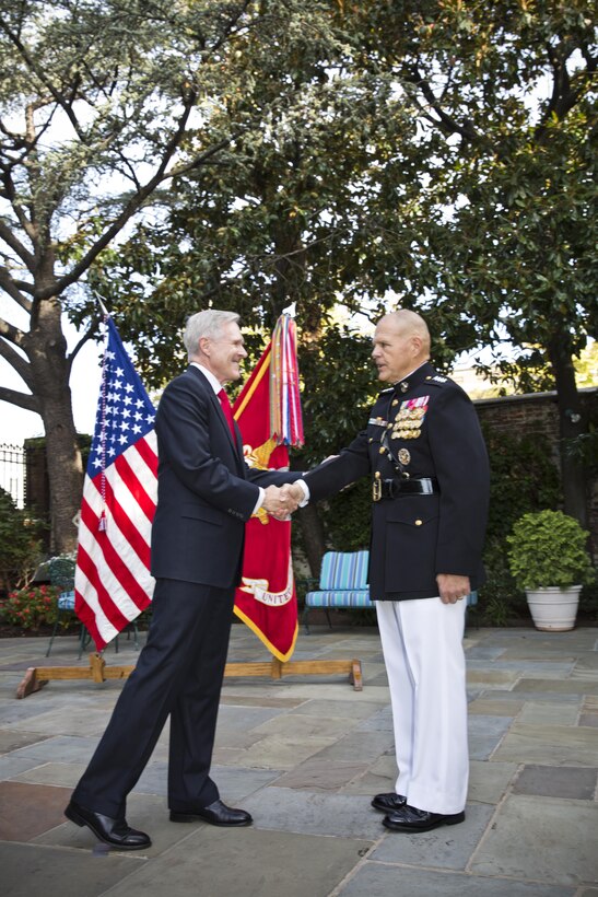 Secretary of the Navy, Raymond Edwin "Ray" Mabus, Jr., left, congratulates Gen. Robert B. Neller during Neller's promotion ceremony at Marine Barracks Washington, D.C., Sept. 24, 2015. Neller was promoted from the rank of lieutenant general to general in the Marine Corps. (U.S. Marine Corps photo by Sgt. Gabriela Garcia/Released)