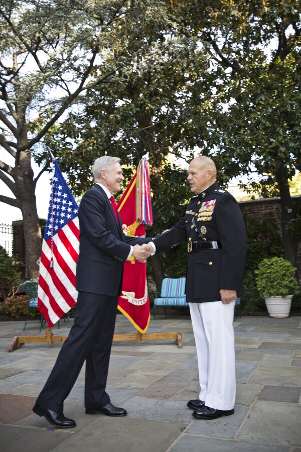 Secretary of the Navy, Raymond Edwin "Ray" Mabus, Jr., left, congratulates Gen. Robert B. Neller during Neller's promotion ceremony at Marine Barracks Washington, D.C., Sept. 24, 2015. Neller was promoted from the rank of lieutenant general to general in the Marine Corps. (U.S. Marine Corps photo by Sgt. Gabriela Garcia/Released)