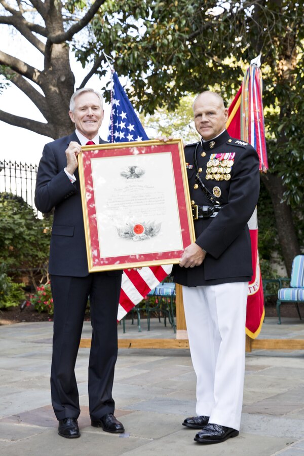 Secretary of the Navy, Raymond Edwin "Ray" Mabus, Jr., left, and Gen. Robert B. Neller, pose during Neller's promotion ceremony at Marine Barracks Washington, D.C., Sept. 24, 2015. Neller was promoted from the rank of lieutenant general to general in the Marine Corps. (U.S. Marine Corps photo by Sgt. Gabriela Garcia/Released)