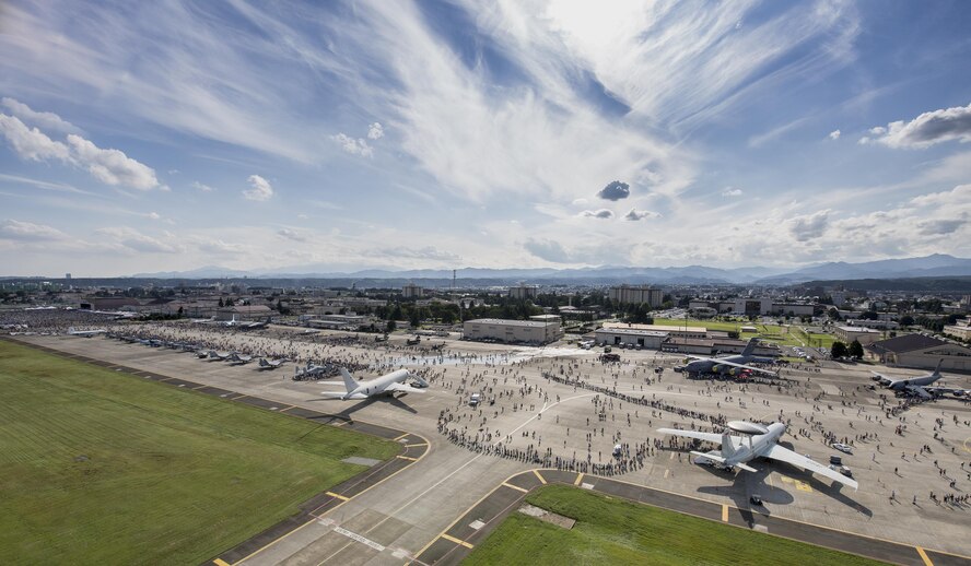 Tens of thousands of visitors crowd the flightily during the 2015 Japanese-American Friendship Festival at Yokota Air Base, Japan, Sept. 19, 2015. Yokota welcomed 185,000 visitors for the festival. (U.S. Air Force photo by Osakabe Yasuo/Released) 