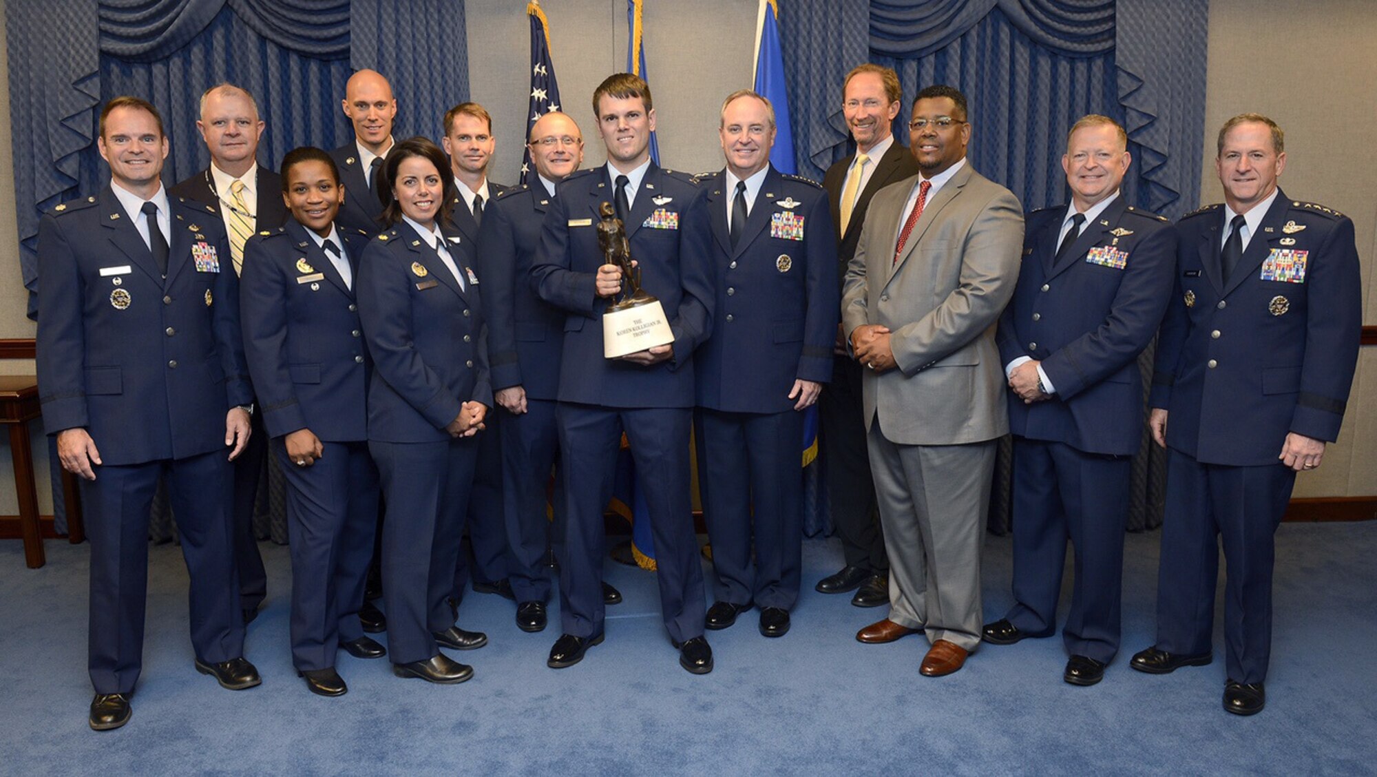 Members of the Air Force Safety program stand with Capt. Timothy Killham (center), an F-35 Lightning II pilot from the 33rd Flying Training Squadron at Eglin Air Force Base, Fla., after he received the Koren Kolligian trophy during a Pentagon ceremony Sept. 23, 2015. The Kolligian Award recognizes outstanding airmanship by an aircrew member and is named after 1st Lt. Koren Kolligian, who went missing while piloting his T-33 aircraft off the coast of California.  (U.S. Air Force photo/Scott M. Ash)