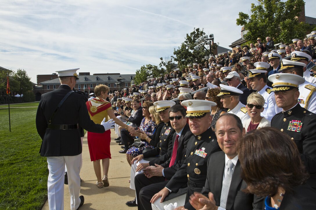 Commandant of the Marine Corps, Gen. Joseph F. Dunford, Jr. and his wife, Ellyn Dunford greet guests before a Passage of Command at Marine Barracks Washington, D.C., Sept. 24, 2015. During the passage, Gen. Robert B. Neller took command from Dunford as the 37th Commandant of the Marine Corps. (U.S. Marine Corps photo by Sgt. Gabriela Garcia/Released)