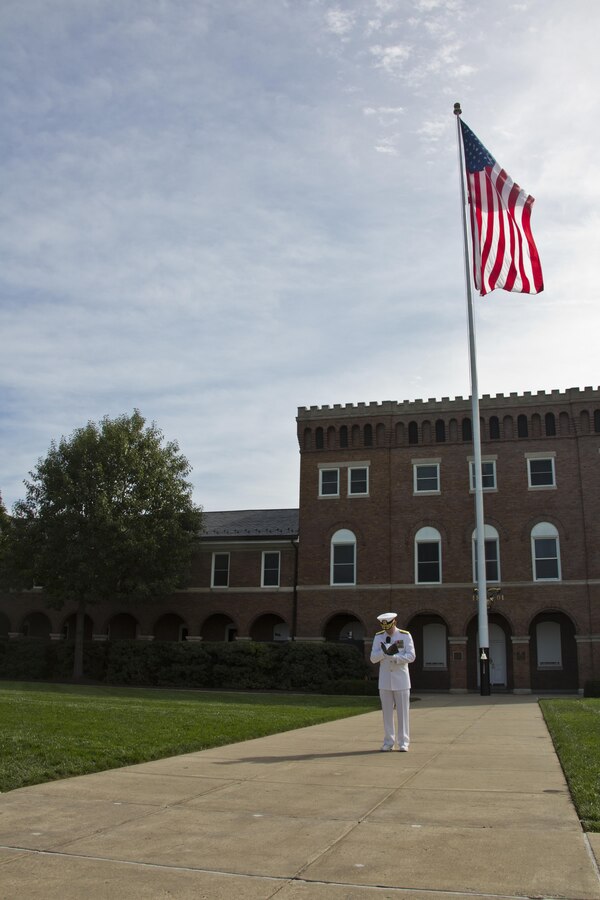 Chaplain of the United States Marine Corps, Rear Adm. Brent W. Scott, reads the invocation during the Passage of Command at Marine Barracks Washington, D.C., Sept. 24, 2015. Gen. Robert B. Neller took command from Gen. Joseph F. Dunford, Jr. as the 37th Commandant of the Marine Corps. (U.S. Marine Corps photo by Sgt. Gabriela Garcia/Released)