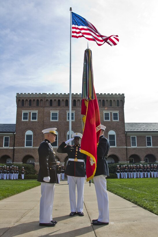 Commandant of the Marine Corps, Gen. Joseph F. Dunford, Jr., right, prepares to pass the Marine Corps colors to Gen. Robert B. Neller, left, at Marine Barracks Washington, D.C., Sept. 24, 2015. Neller took command from Dunford as the 37th Commandant of the Marine Corps. (U.S. Marine Corps photo by Sgt. Gabriela Garcia/Released)