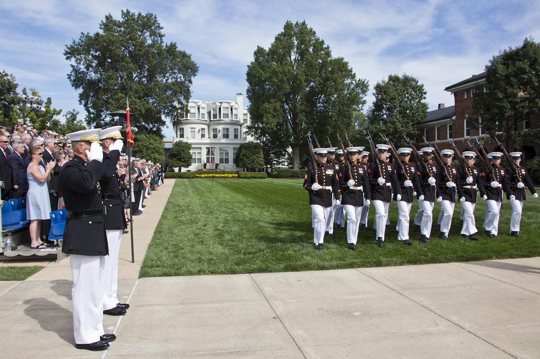 Commandant of the Marine Corps, Gen. Robert B. Neller and Gen. Joseph F. Dunford, Jr. salute the Marine Corps colors during the Passage of Command at Marine Barracks Washington, D.C., Sept. 24, 2015. Neller took command from Dunford as the 37th Commandant of the Marine Corps. (U.S. Marine Corps photo by Sgt. Gabriela Garcia/Released)