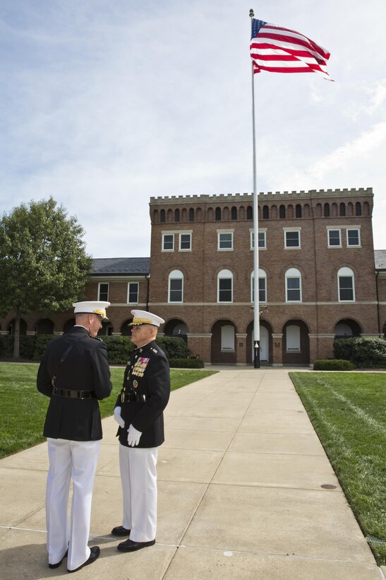 Commandant of the Marine Corps, Gen. Robert B. Neller and Gen. Joseph F. Dunford, Jr. talk after the Passage of Command at Marine Barracks Washington, D.C., Sept. 24, 2015. Neller took command from Dunford as the 37th Commandant of the Marine Corps. (U.S. Marine Corps photo by Sgt. Gabriela Garcia/Released)