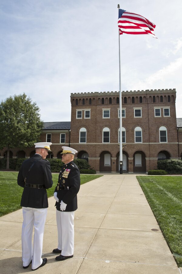 Commandant of the Marine Corps, Gen. Robert B. Neller and Gen. Joseph F. Dunford, Jr. talk after the Passage of Command at Marine Barracks Washington, D.C., Sept. 24, 2015. Neller took command from Dunford as the 37th Commandant of the Marine Corps. (U.S. Marine Corps photo by Sgt. Gabriela Garcia/Released)