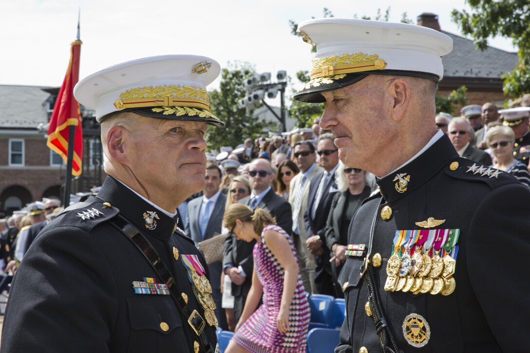 Commandant of the Marine Corps, Gen. Robert B. Neller and Gen. Joseph F. Dunford, Jr. talk after the Passage of Command at Marine Barracks Washington, D.C., Sept. 24, 2015. Neller took command from Dunford as the 37th Commandant of the Marine Corps. (U.S. Marine Corps photo by Sgt. Gabriela Garcia/Released)