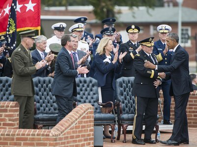 President of the United States Barack Obama speaks to 18th Chairman of the Joint Chiefs of Staff U.S. Army Gen. Martin E. Dempsey at his retirement and change of responsibility ceremony. Dempsey retires from the military after 41 years in service and is succeeded by Marine Gen. Joseph Dunford. The ceremony took place at Joint Base Myer-Henderson Hall in Washington on Sept. 25, 2015.