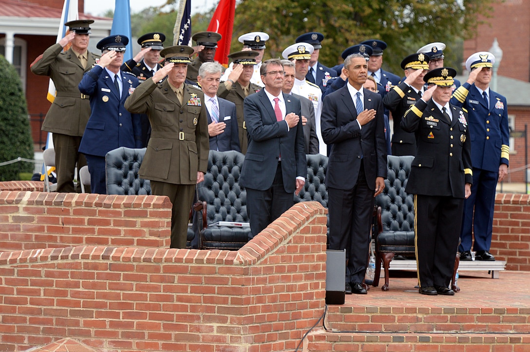 President Barack Obama, Defense Secretary Ash Carter and Marine Gen. Joseph F. Dunford Jr, the new chairman, render honors during the change of responsibility ceremony between the outgoing chairman of the Joint Chiefs of Staff Army Gen. Martin E. Dempsey, on Summerall Field, Joint Base Myer-Henderson Hall, Arlington, Va. Sept. 25, 2015. DoD photo by U.S. Army Sgt. 1st Class Clydell Kinchen