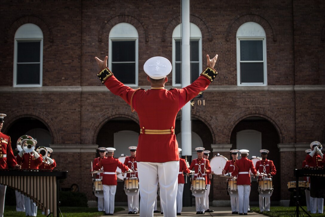 The United States Marine Drum and Bugle Corps performs during the Passage of Command between Gen. Joseph F. Dunford Jr., 36th commandant of the Marine Corps, and Gen. Robert B. Neller, 37th commandant of the Marine Corps, at Marine Barracks Washington, D.C., Sept. 24, 2015.(U.S. Marine Corps photo by Sgt. Melissa Marnell/Released)