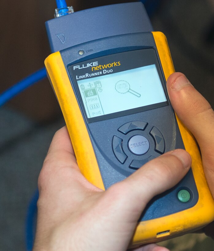 An Airman from the 23d Communication Squadron utilizes a network multimeter device Sept. 23, 2015, at Moody Air Force Base, Ga. This device is used as a counterpart with an inductive amplifier to send signals to test network connectivity paths. (U.S. Air Force photo by Airman 1st Class Greg Nash/Released) 