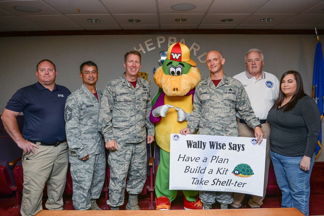 Brig. Gen. Patrick Doherty, 82nd Training Wing commander, and Col. Timothy Gillaspie, 82nd Training Wing vice commander, meet with the 82nd Emergency Management and Wally Wise, the shelter in place turtle, during National Preparedness Month at Sheppard Air Force Base, Texas, Sept. 25, 2015. Sheppard focused on four themes to increase awareness for floods, wildfires, hurricanes and power outages. (U.S. Air Force photo/Senior Airman Kyle Gese)