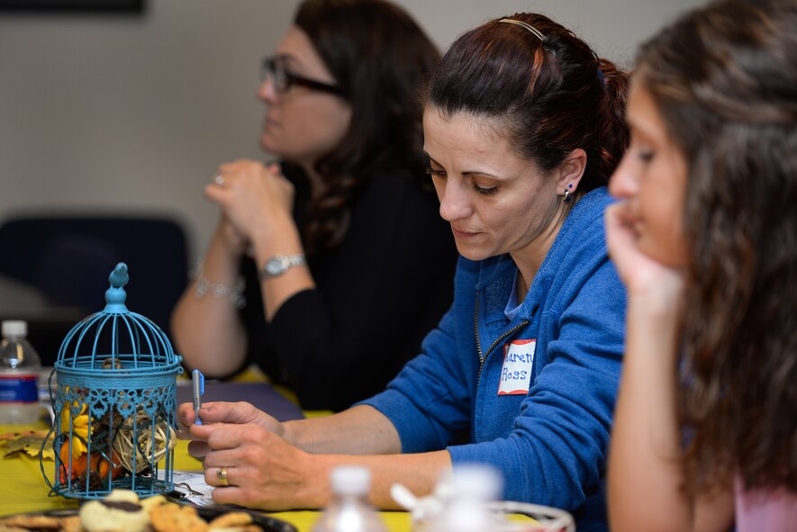 Karen Ross takes notes during the Heartlink military spouse orientation at Sheppard Air Force Base, Texas, Sept. 24, 2015. Heartlink teaches spouses about different programs available to them around the base. (U.S. Air Force photo/Senior Airman Kyle Gese)