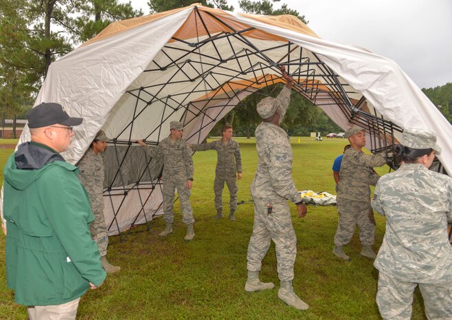 Members of the 628th Medical Group and the 628th Civil Engineering Squadron setup a mock site to be part of a hazardous material exercise on Joint Base Charleston – Air Base, S.C., Sept. 25, 2015. The two units from the 628th CES were the emergency management group and fire department. (U.S. Air Force photo/Airman 1st Class Thomas T. Charlton)