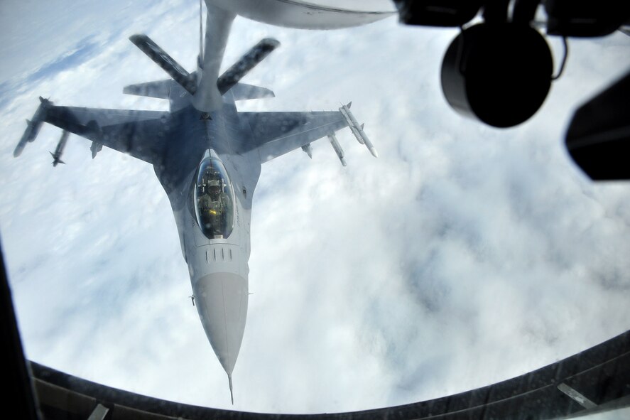 A 113th Wing DC Air National Guard F-16 Fighting Falcon is refueled by a KC-135R Stratotanker over the Pacific Ocean recently. During the mission the 756th Air Refueling Squadron refueled eight F-16 Fighting Falcons from the 113th Wing D.C. Air National Guard using two KC-135R refueling tankers. (U.S. Air force photo by Staff Sgt. Kat Justen)