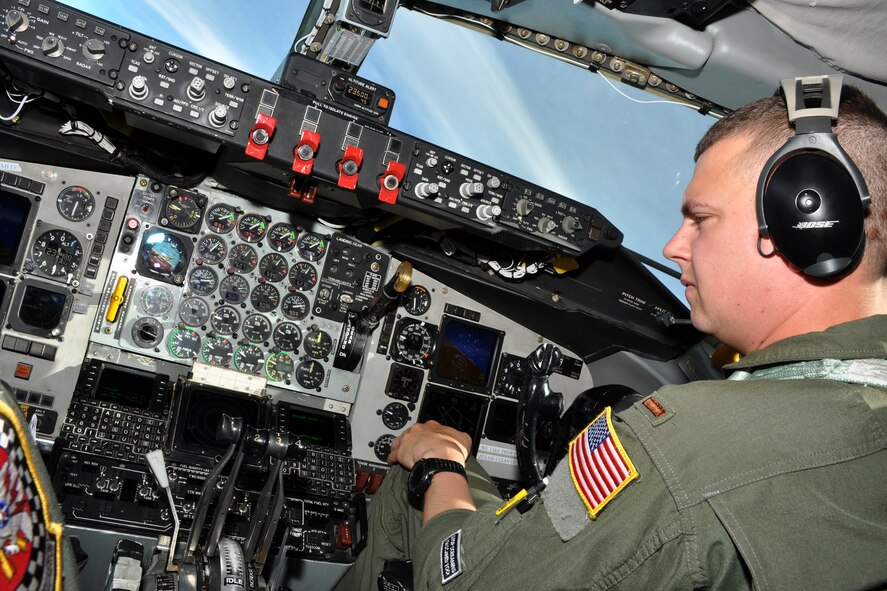 Air Force 2nd Lt. Kyle Swenson, a pilot with the 756th Air Refueling Squadron, monitors the instrument panel inside the cockpit of a KC-135R Stratotanker during an inflight refueling mission over the Pacific Ocean recently. During the flight, the 756 ARS refueled eight F-16 Fighting Falcons from the 113th Wing D.C. Air National Guard using two KC-135R refueling tankers. (U.S. Air force photo by Staff Sgt. Kat Justen)