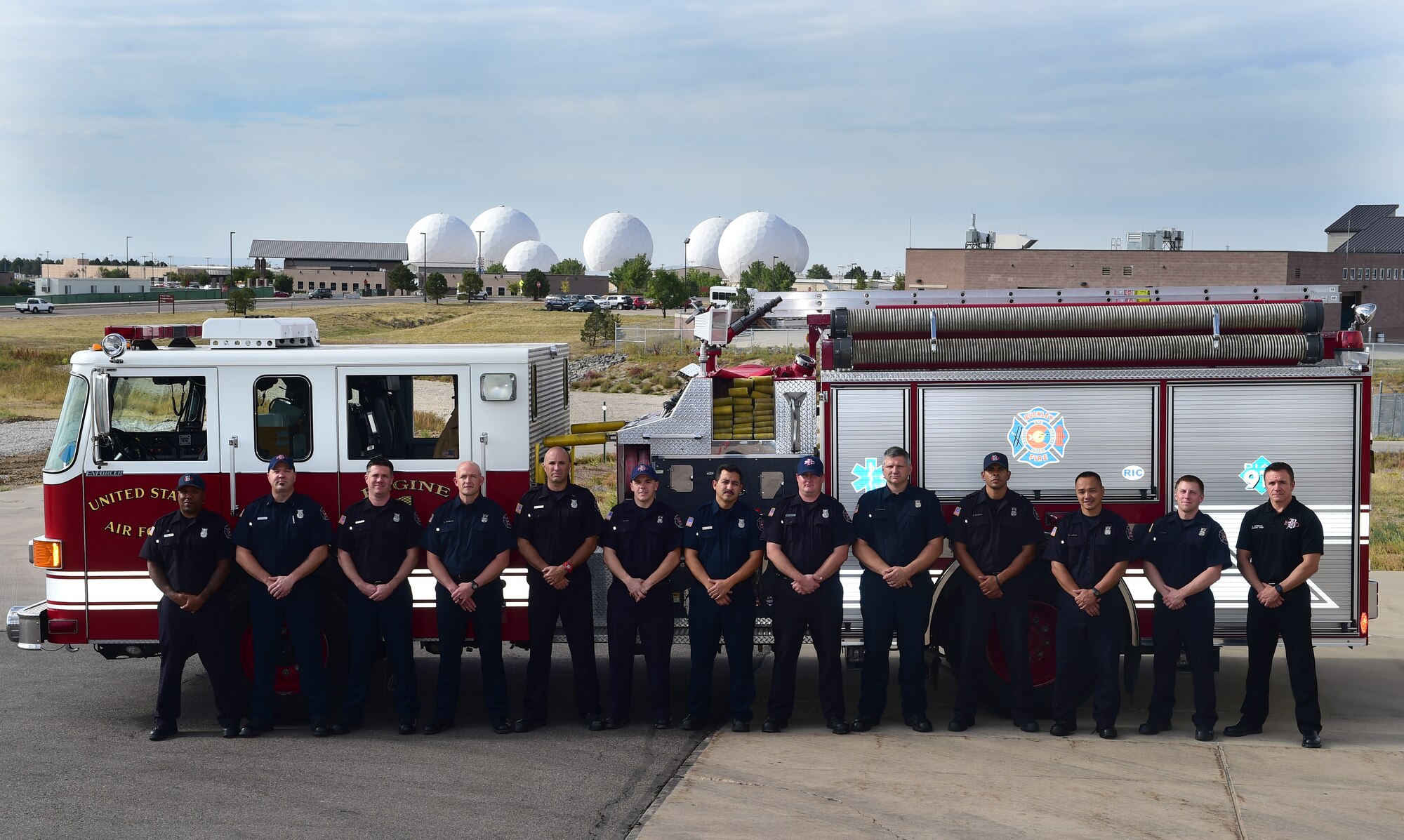 The Buckley Fire Department poses for a photograph Sept. 22, 2015, on Buckley Air Force Base, Colo. The fire department was recently given permission by Air Force officials to resume the use of paramedics on base, cutting response times in half and allowing fire department personnel to use their capabilities to the fullest. (U.S. Air Force photo by Airman 1st Class Luke W. Nowakowski/Released)