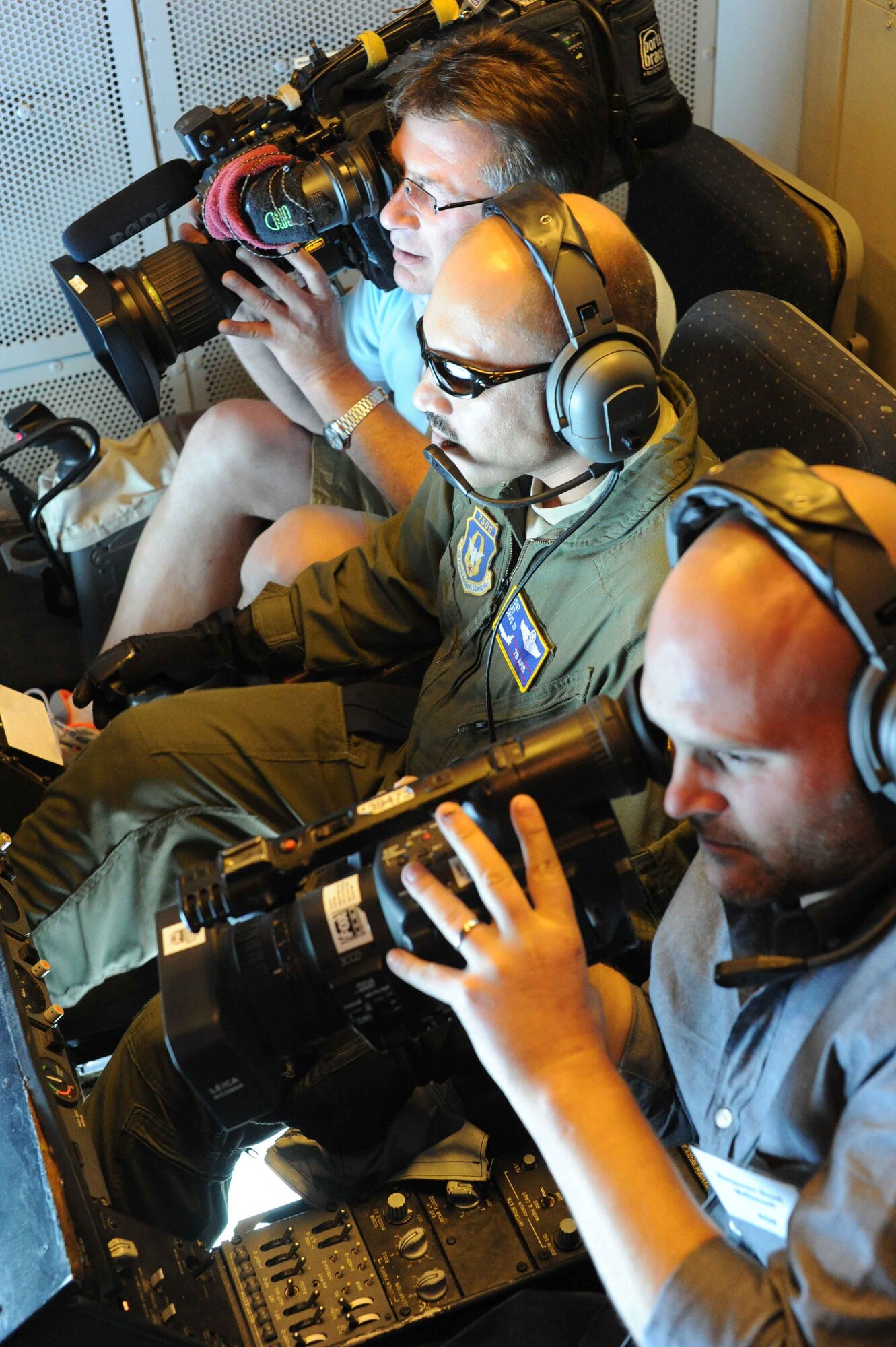 Master Sgt. Ray Cruz, and in-flight refueling specialist for the 78th Air Refueling Squadron at Joint Base McGuire Dix Lakehurst, New Jersey, refuels aircraft as Fox news gets stock video footage for the Air Force's 68th birthday. The 514th AMW celebrated two days early, displaying its air refueling capabilities for media in New York City Sept. 16. (U.S.Air Force photo by Master Sgt. Donna Jeffries)