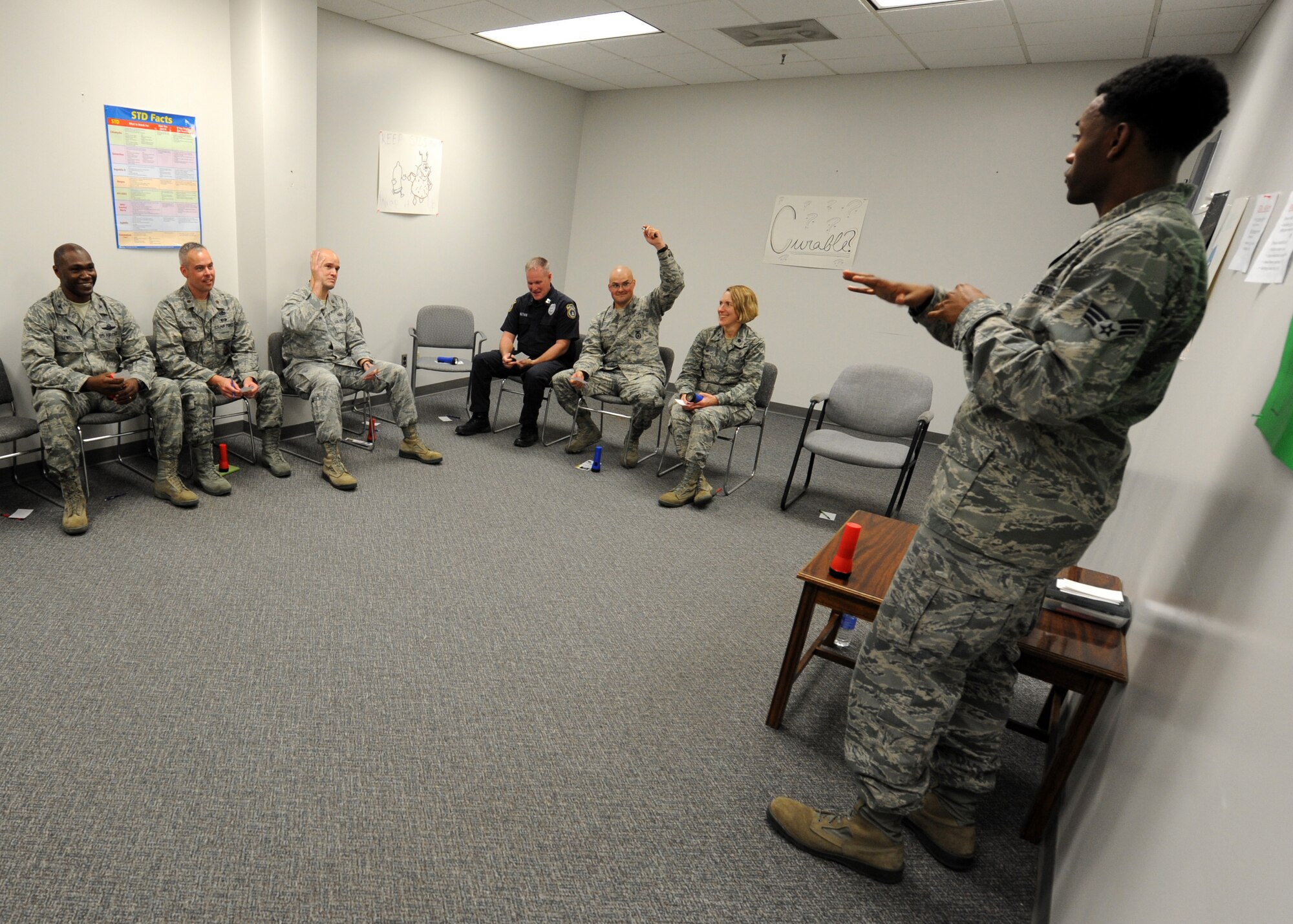 Senior Airman Andrew JeanJacques, 319th Logistics Readiness Squadron customer service journeyman, briefs members of the 319th Air Base Wing leadership in the Tunnel of Oppression Sept. 24, 2015, on Grand Forks Air Force Base, North Dakota. JeanJacques is one of the Airmen that volunteer their time to speak about serious issues that they have experienced in their lives. The Tunnel provides a place for Airmen to speak about these issues openly. (U.S. Air Force photo by Airman 1st Class Ryan Sparks/Released)