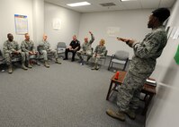 Senior Airman Andrew JeanJacques, 319th Logistics Readiness Squadron customer service journeyman, briefs members of the 319th Air Base Wing leadership in the Tunnel of Oppression Sept. 24, 2015, on Grand Forks Air Force Base, North Dakota. JeanJacques is one of the Airmen that volunteer their time to speak about serious issues that they have experienced in their lives. The Tunnel provides a place for Airmen to speak about these issues openly. (U.S. Air Force photo by Airman 1st Class Ryan Sparks/Released)