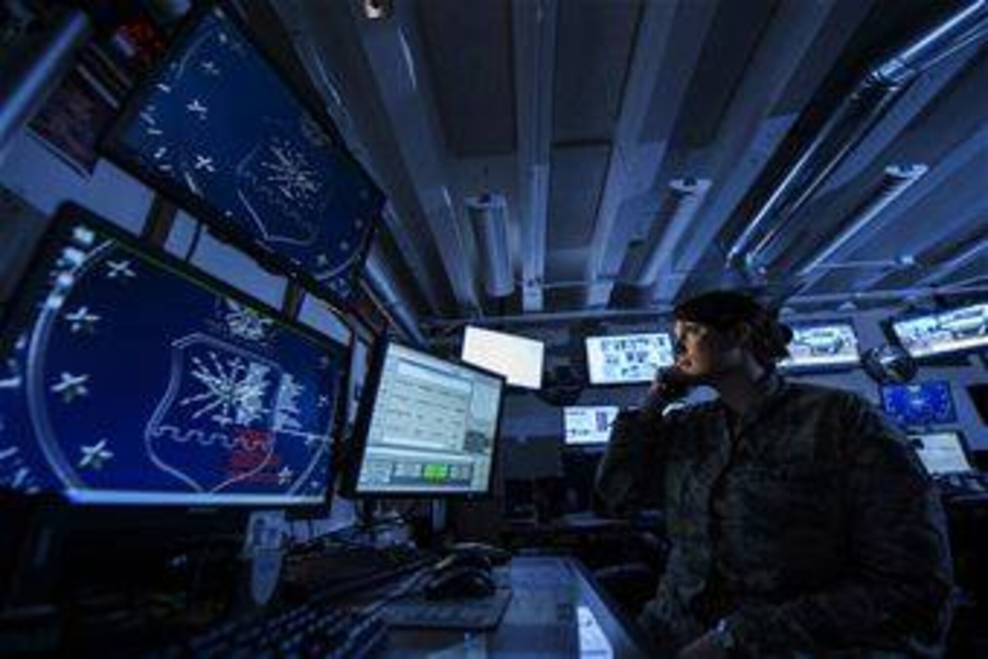 Tech. Sgt. Amber Perry, 2nd Bomb Wing command post controller, monitors base activities to help facilitate the wing's mission at Barksdale Air Force Base, Louisiana. Command post is one of 27 AFSCs on the NCO retraining program retraining-in list. (U.S. Air Force photo by Staff Sgt. Jonathan Snyder)