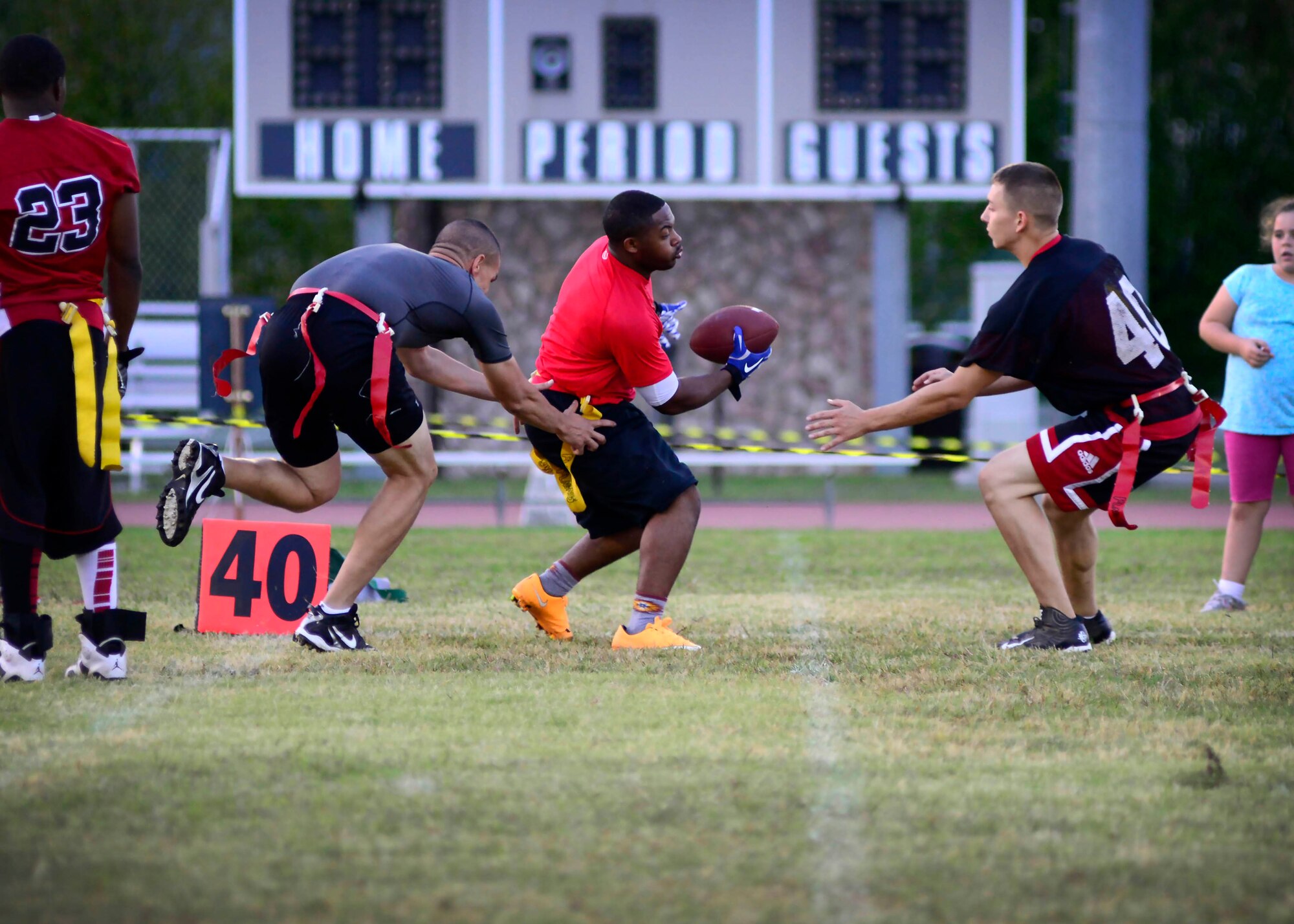 U.S. Air Force Airmen assigned to the 31st Maintenance Squadron and 31st Communications Squadron compete against each other during an intramural flag football game, Sept. 24, 2015, at Aviano Air Base, Italy.  Games are played every Tuesday and Thursday starting at 5:30 p.m. at Freedom Park until Oct. 31. (U.S. Air Force photo by Senior Airman Areca T. Bell/Released)