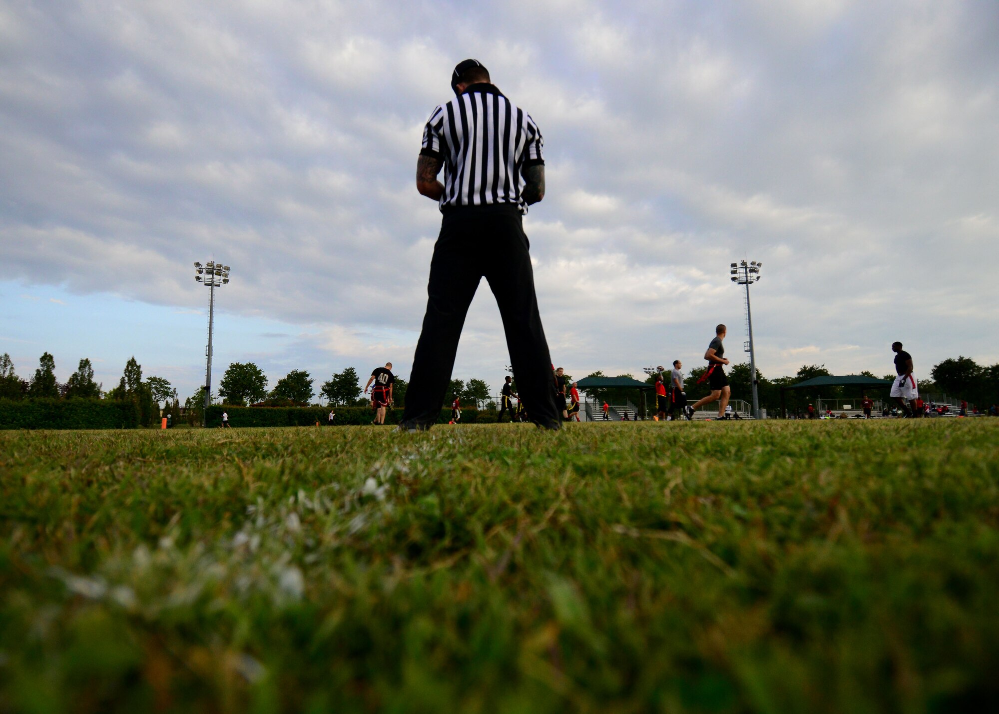 A referee watches an intramural flag football game, Sept. 24, 2015, at Aviano Air Base, Italy.  Games are played every Tuesday and Thursday starting at 5:30 p.m. at Freedom Park until Oct. 31. (U.S. Air Force photo by Staff Sgt. Evelyn Chavez/Released)